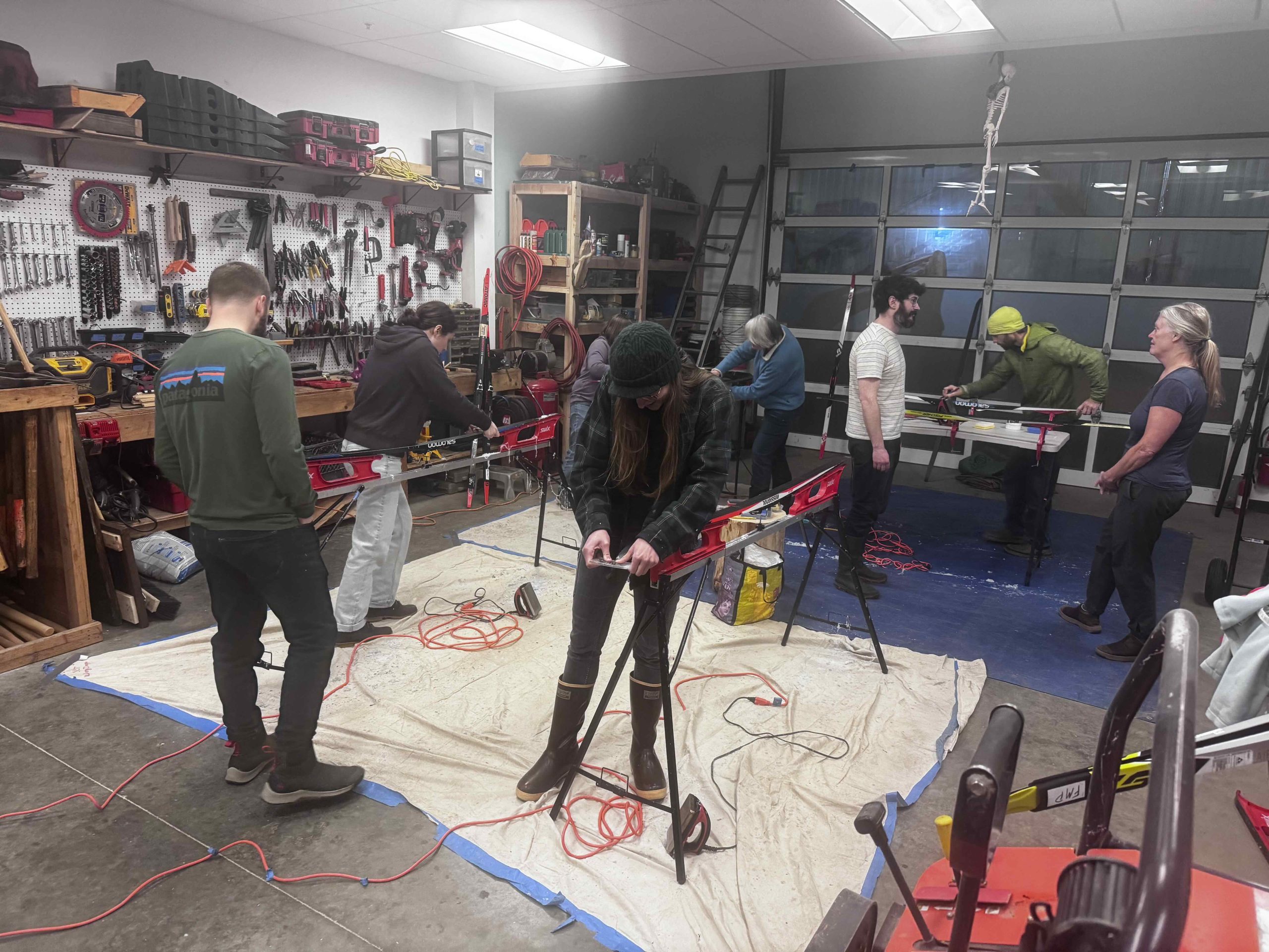 adult wax group of adults waxing cross country skis